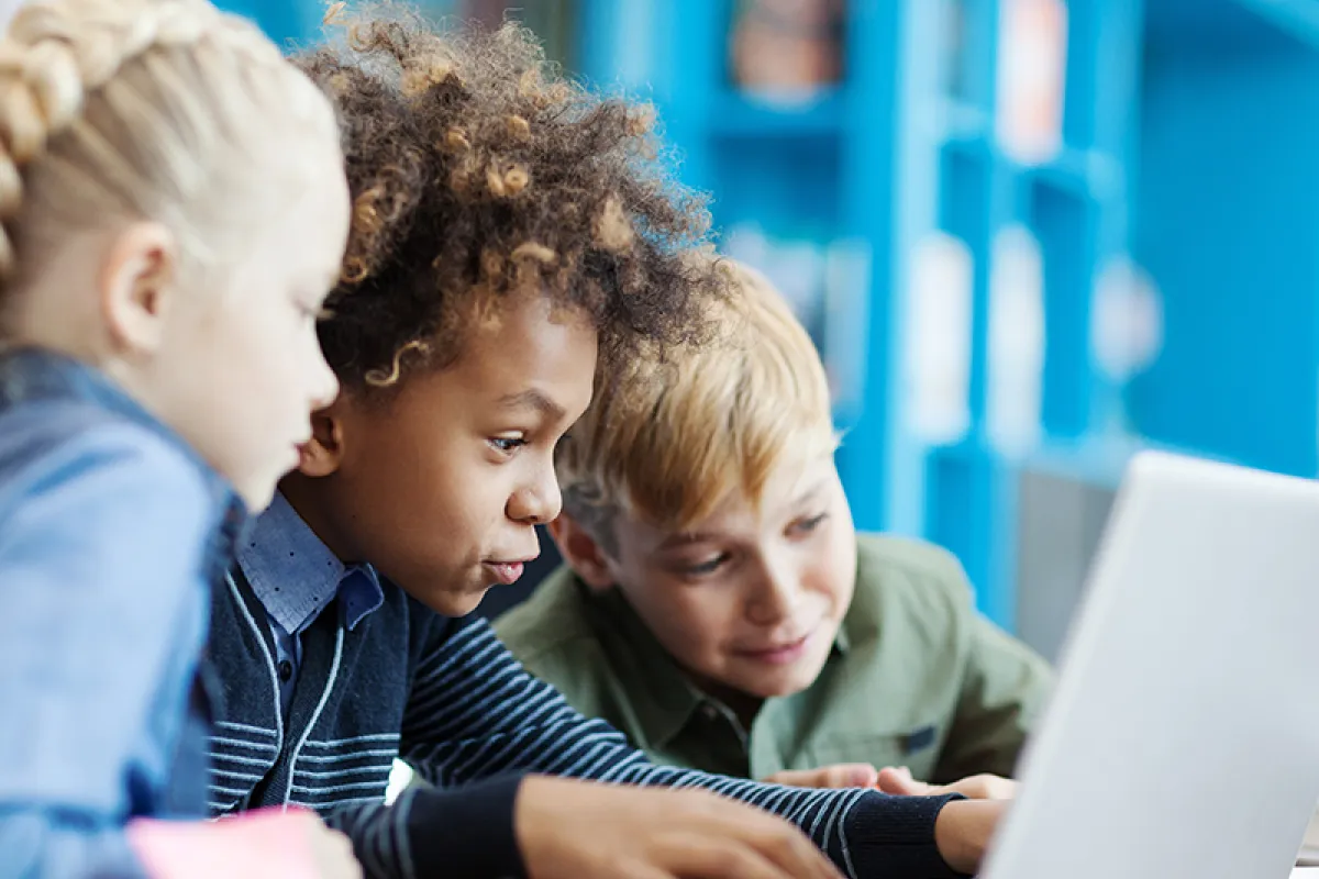 Image of children using a laptop together